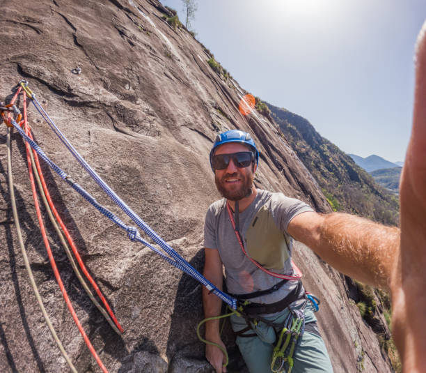 istock Smiling Rock Climber Taking a Selfie with Scenic Mountain View 2158389183