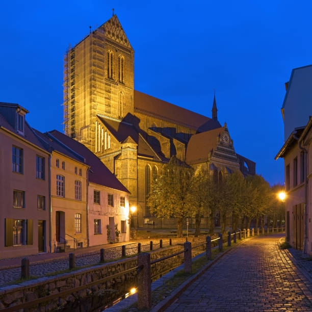 Wismar, Germany. St. Nicholas Church (Nikolaikirche) in dusk. The church was built from 1381 to 1487. It is considered a masterpiece of medieval brick architecture in the Northern European region.