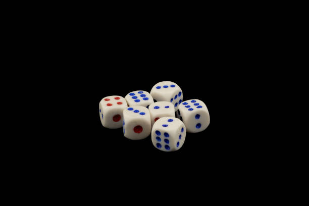 istock Colorful game pieces and dice on a black background 2158392110