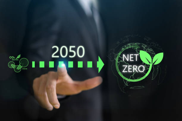 istock Businessman point at net zero carbon emission target for 2050, sustainability, environmental responsibility and corporate commitment to reducing carbon footprint, CSR, renewable energy, eco-friendly 2158392954