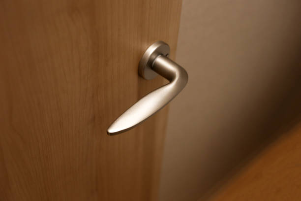 istock Wooden door open, metallic handle 2158397534