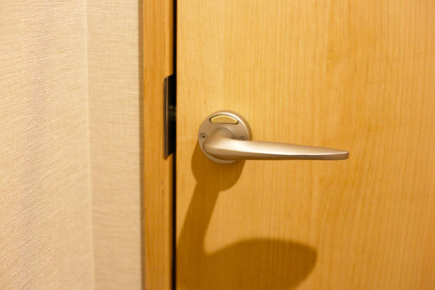 Wooden door with metallic handle