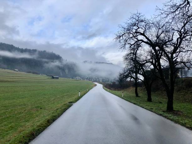 istock Autumn foggy road 2158398249