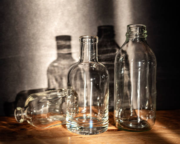 istock Still life with glass bottles, quiet shadows in the background, soft evening light 2158398484