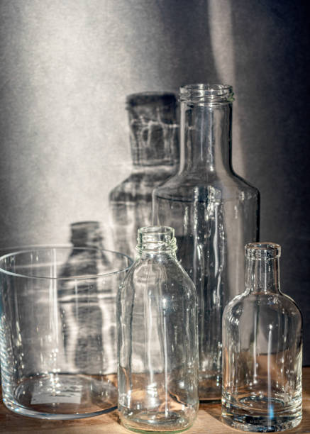 istock Still life with glass bottles, quiet shadows in the background, soft evening light 2158398531