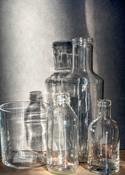 istock Still life with glass bottles, quiet shadows in the background, soft evening light 2158398535