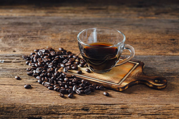 istock Coffee cups and coffee beans on wooden background 2158399282