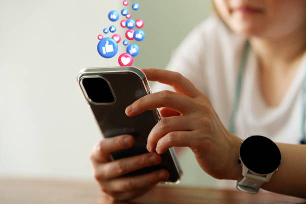 istock woman use phone for social media connectio with icon floaters 2158403071