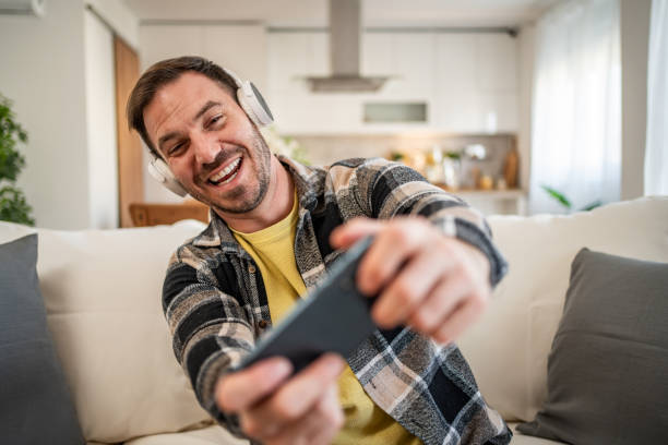 istock A man bets online during a football match. 2158403442