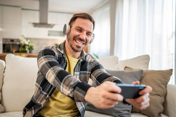 istock A man bets online during a football match. 2158403443