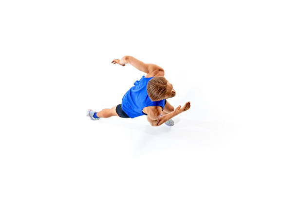 Isometric view. Determined and focused man, athlete in motion, running, competing isolated on white studio background. Concept of sport, marathon, competition, healthy and active lifestyle