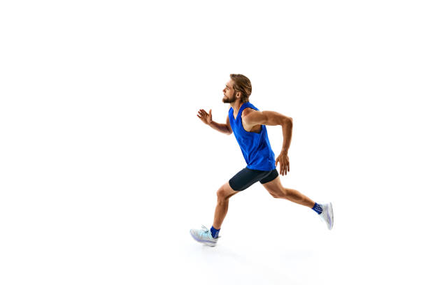istock Athletic and determined man, runner in motion, training, growing speed for marathon isolated on white studio background 2158403546
