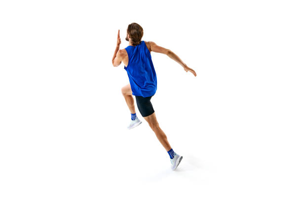 istock Athletic and determined man, runner in motion, training, growing speed for marathon isolated on white studio background 2158403549