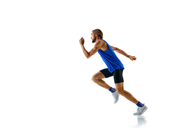 istock Dynamic image of competitive and forced man, muscular runner in motion, training isolated on white studio background 2158403572