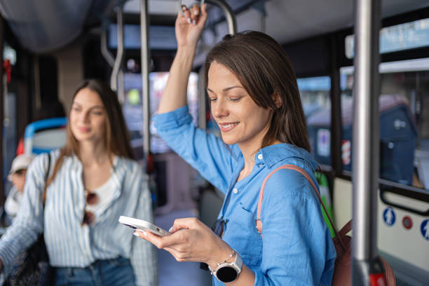 istock Young woman using phone while riding in a bus in Palma De Mallorca 2158403642