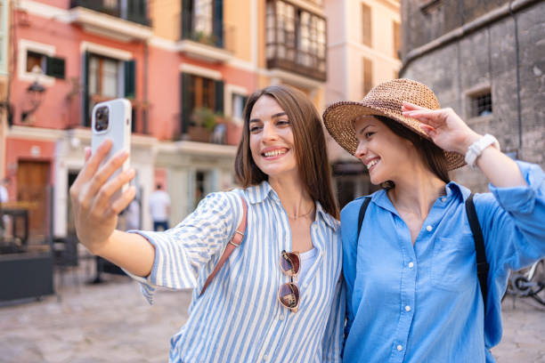istock Beautiful young female friends taking a selfie, while exploring Palma de Mallorca 2158404102