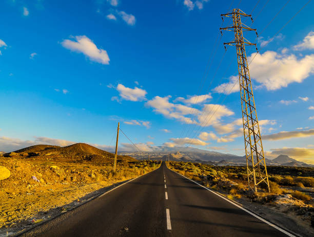 istock A long road with a power line running along it 2158404327