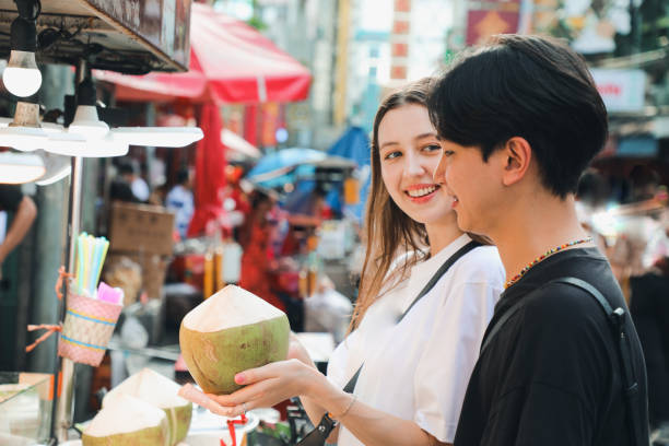 istock Couples Enjoy local food in Asia 2158406401