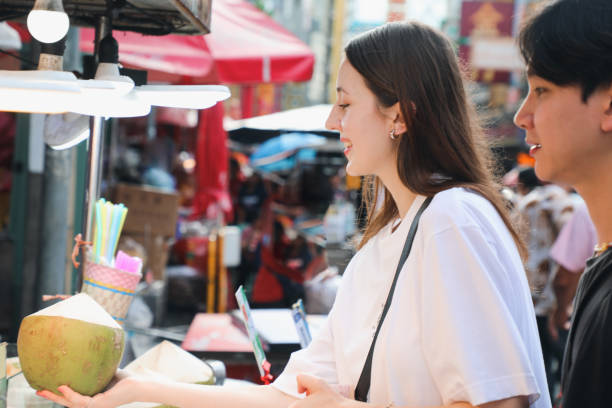 istock Couples Enjoy local food in Asia 2158406402