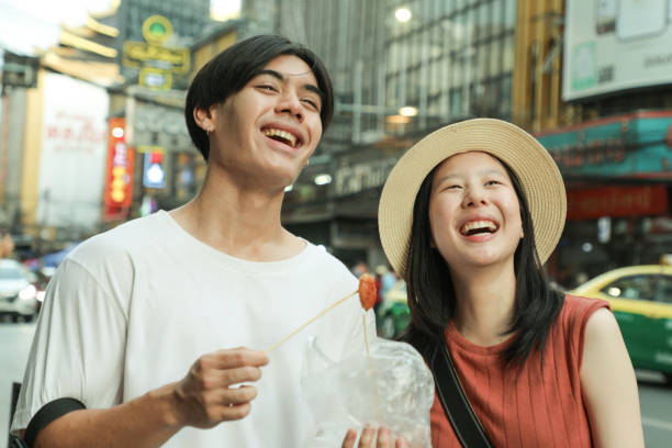 istock Couples Enjoy local food in Asia 2158406473