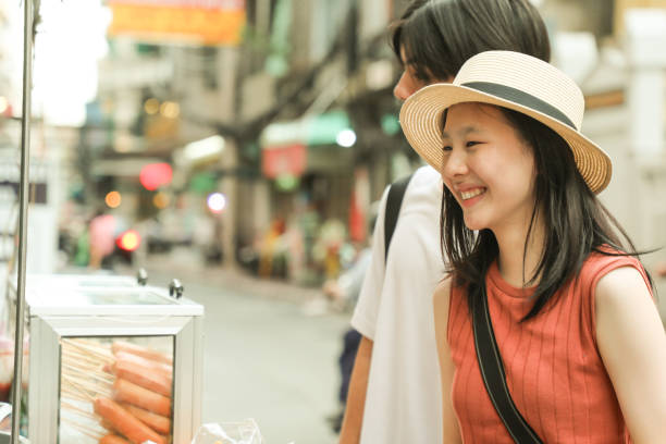 istock Couples Enjoy local food in Asia 2158406474