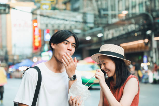 istock Couples Enjoy local food in Asia 2158406484