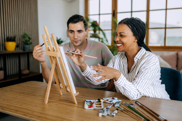 istock Couple creating art together at home 2158408162