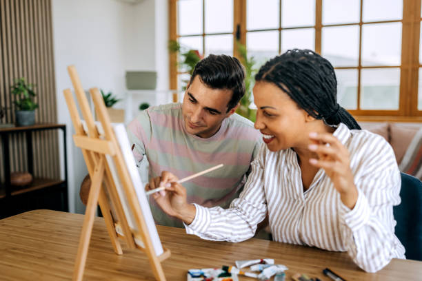 Couple creating art together at home