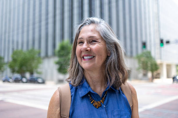 istock Smiling senior woman outdoors in urban setting 2158411516