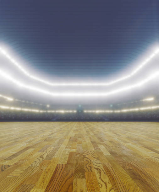 A generic seated indoor arena stadium with a wooden court playing surface under illuminated floodlights - 3D render