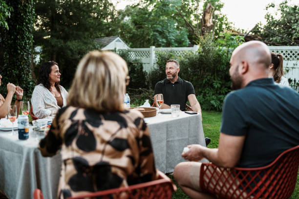 istock Friends gather in backyard to celebrate a wedding weekend 2158417002