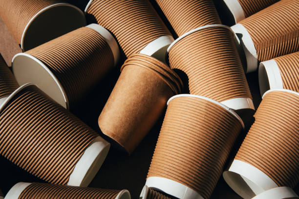 istock A set of paper utensils, brown cups on a brown background. Eco friendly, zero waste concept 2158417073