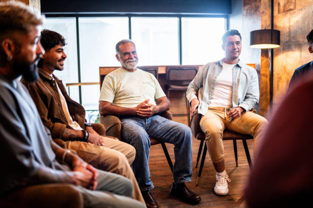 istock Men talking in group therapy at mental health center 2158417552