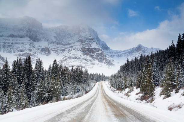 Highway leading to snowcapped mountains