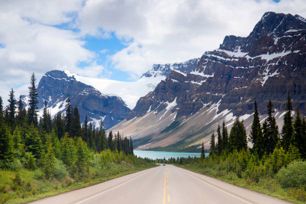 istock Highway leading to snowcapped mountains 2158418688