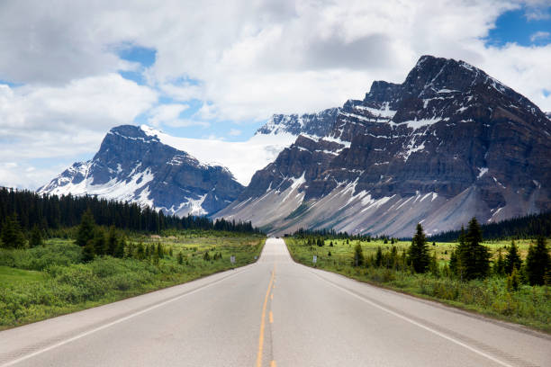 istock Highway leading to snowcapped mountains 2158418690