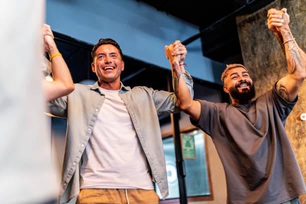 istock Men talking and celebrating during males group therapy 2158419224