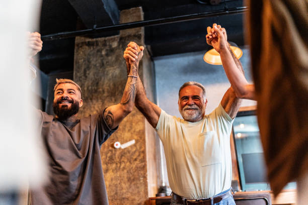 istock Men talking and celebrating during males group therapy 2158419261