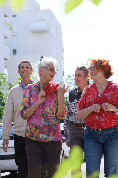 Oviedo, Spain-21 September, 2018: Senior women sitting on a public park bench, enjoying friendship, resting. High angle view