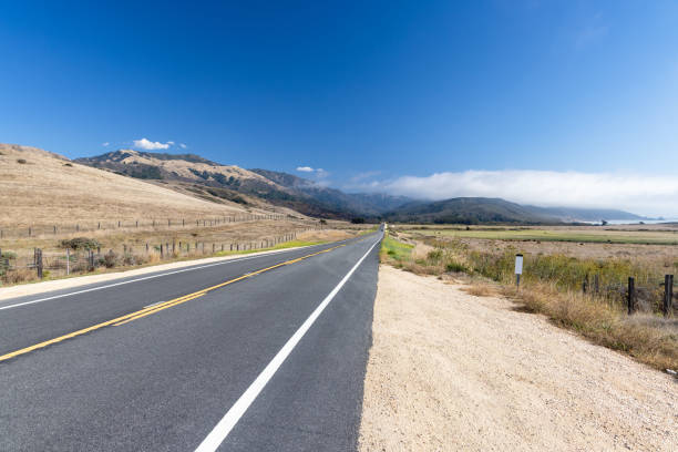 Asphalt road and countryside landscape of Highway 1 in United States