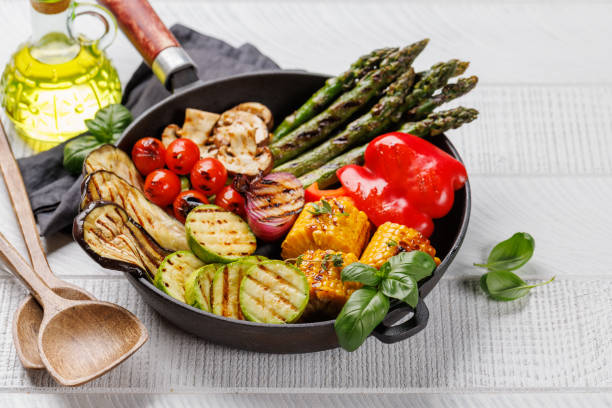istock Assorted grilled vegetables on a frying pan, showcasing a colorful meal 2158428376