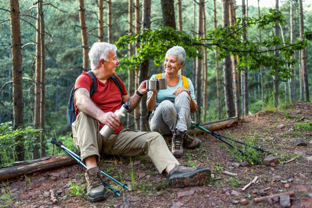 istock Senior couple of hikers taking a break 2158429538