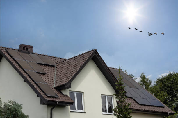 istock House with Solar Panels and Clear Sky 2158429888