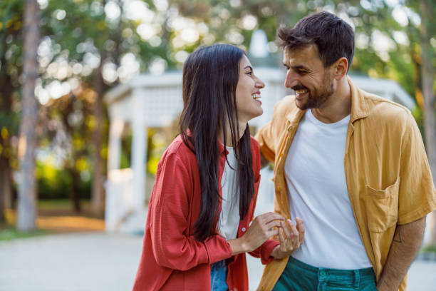 istock Couple holding hands and looking into each other's eyes 2158431411