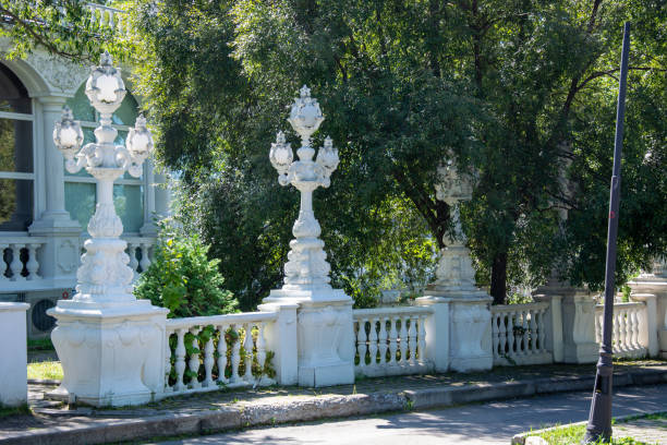 Moscow, Russia August 28, 2023 Park landscape. Stone-paved structures in the park and green trees with grass