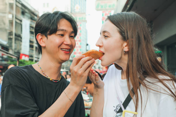 istock Couples Enjoy local food in Asia 2158434828