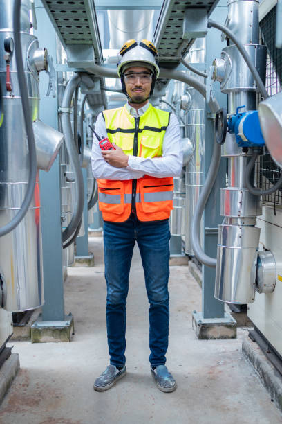 istock Engineer Inspecting Industrial Machinery with Tablet 2158436070