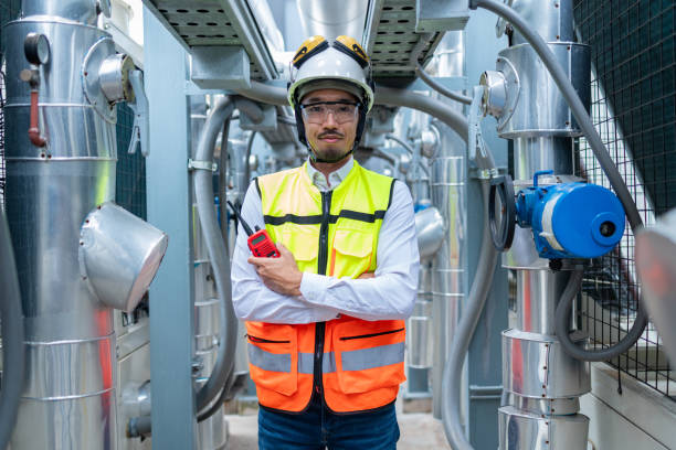 istock Engineer Inspecting Industrial Machinery with Tablet 2158436266