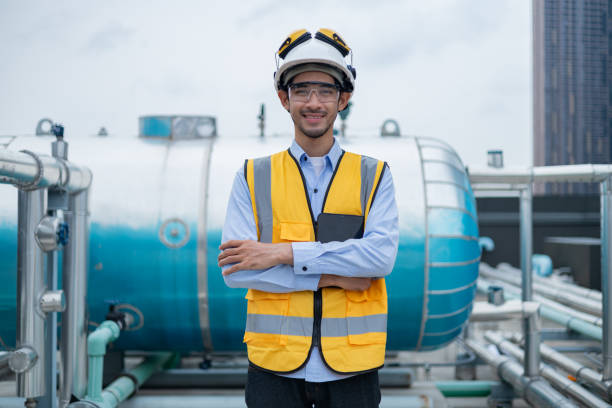 istock Engineer under checking the industry chilled water fan coil unit air conditioner is water cooling tower air chiller HVAC system of large industrial building to control air system 2158437165