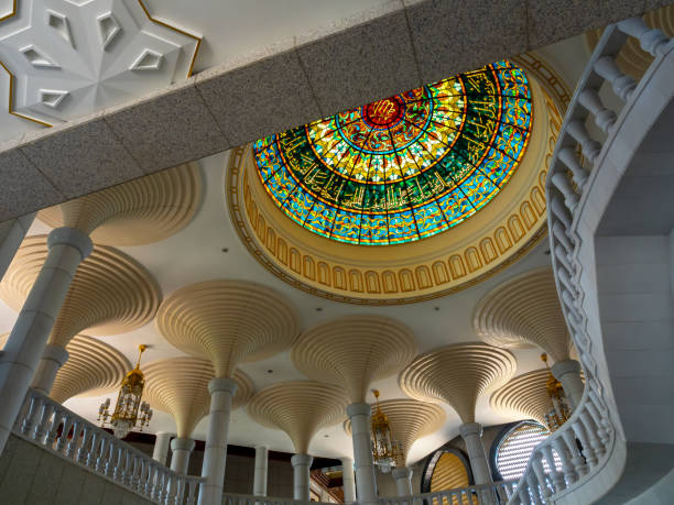 Cupola with beauty stained glass ceiling under rooftop decorated inside jame' asr hassanil bolkiah mosque, named after 29th and current sultan of brunei.